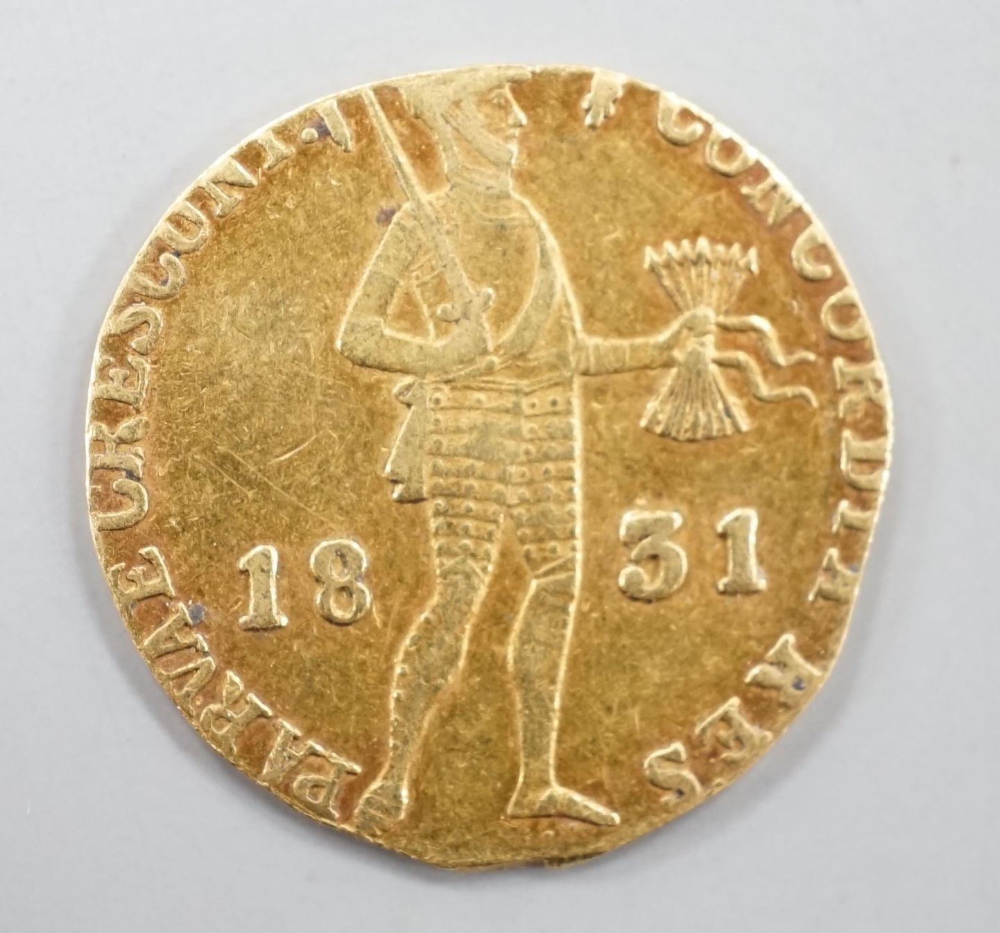 A Netherlands 1831 gold ducat coin.